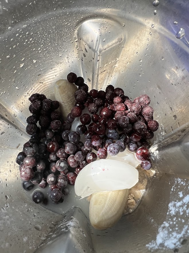 Frozen fruits in a blender.