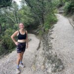 runner on a scenic forest path in chickasaw national recreation area one of the best national parks to run in