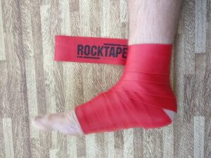 Foot wrapped in red tape