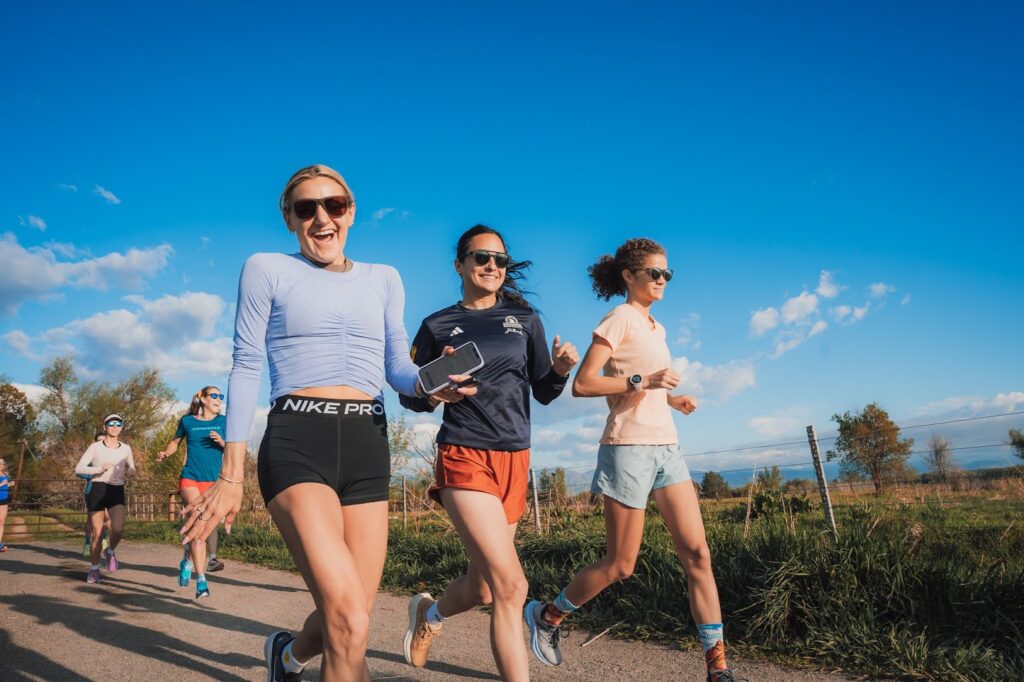 Group of women jogging outdoors.