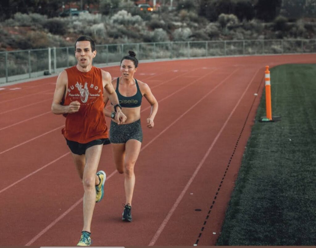 Two runners on a track