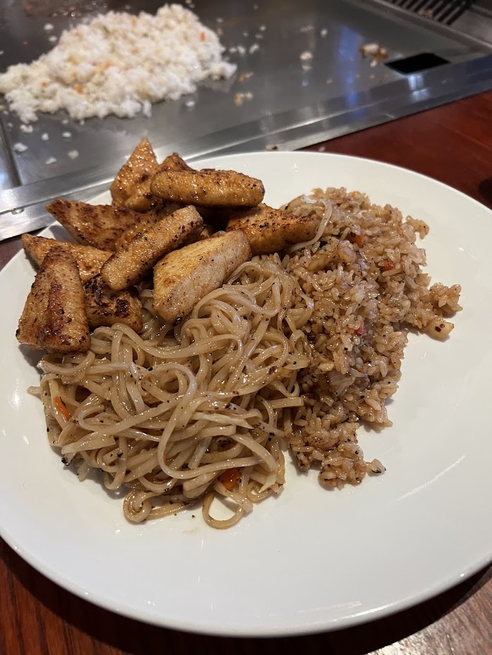 Plate of chicken, rice, and noodles